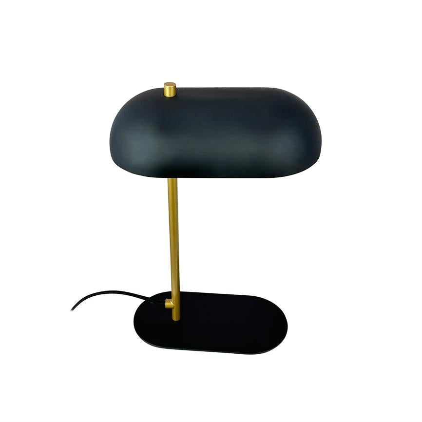 Black table lamp with round, curved shade, mounted on a golden vertical rod and black oval base; black wire is at the base; placed against a white, uniform background.