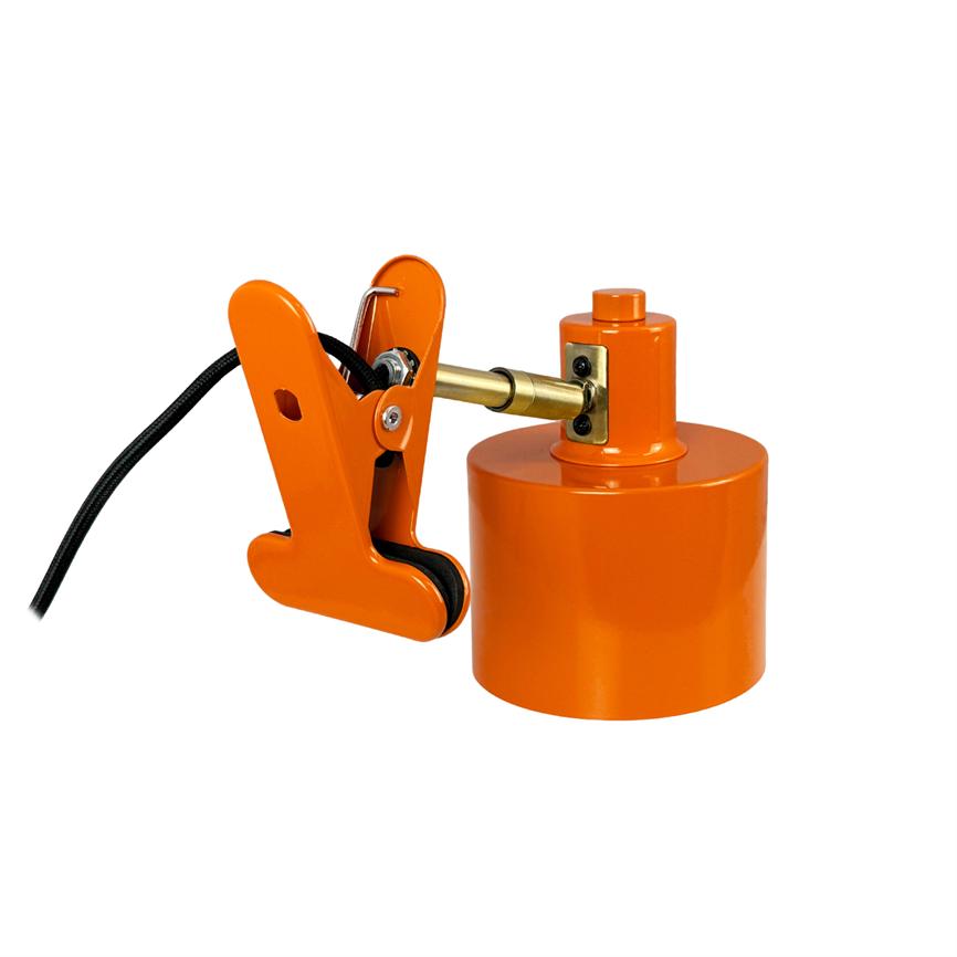 An orange clamp holds a black wire and is connected via a brass hinge to a round orange cylinder, placed on a clean white background.