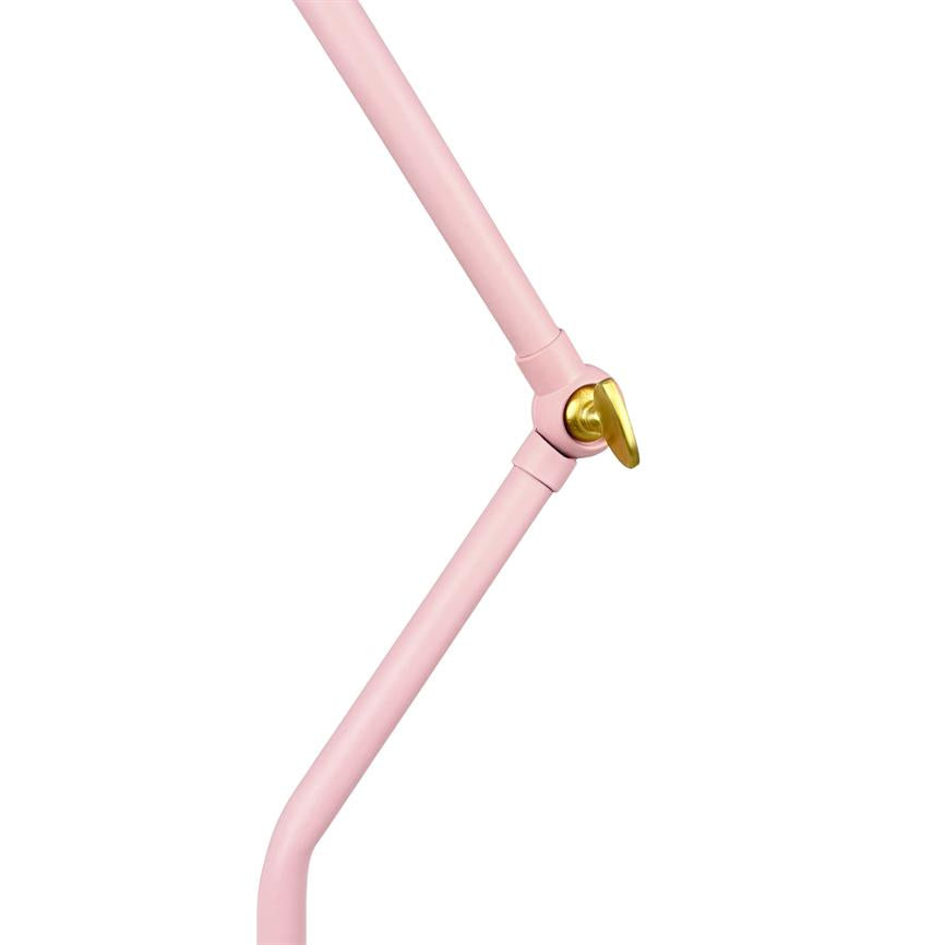 Pink lamp arm bends at a hinge where a gold colored locking handle adjusts the joint; minimalistic white background creates a studio-like, isolated presentation.