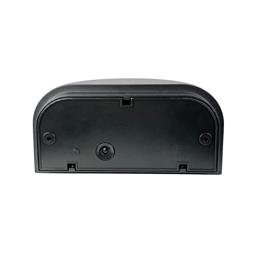 Black plastic module lies flat; face plate with three round openings/screw holes and a central insert, placed on a uniform white background.
