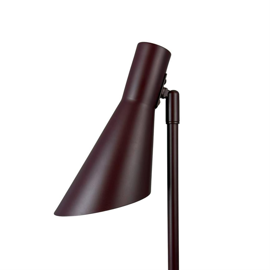 Lamp head facing obliquely downwards, mounted on a vertical pole; matte burgundy metal, conical shape with adjustable bracket. Surrounded by a clean, white background with no other objects.