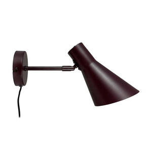 Wall lamp mounted on round wall bracket; arm extends horizontally, adjustable cone-shaped screen points downwards. Dark burgundy metal finish and visible black wire.
