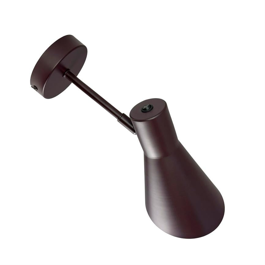 Wall lamp points downwards against a white background; slim, cone-shaped matte dark bronze shade with short adjustable arm and round wall bracket.