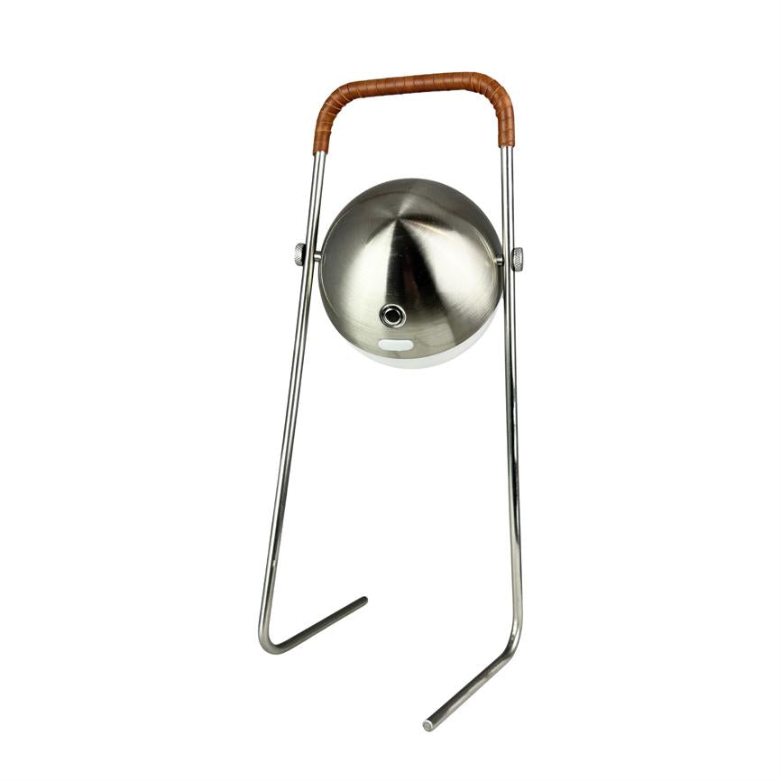 A round, brushed steel lamp hangs between two slender chrome rods and points downwards; the top handle is wrapped in brown leather, all shown against a neutral white background.