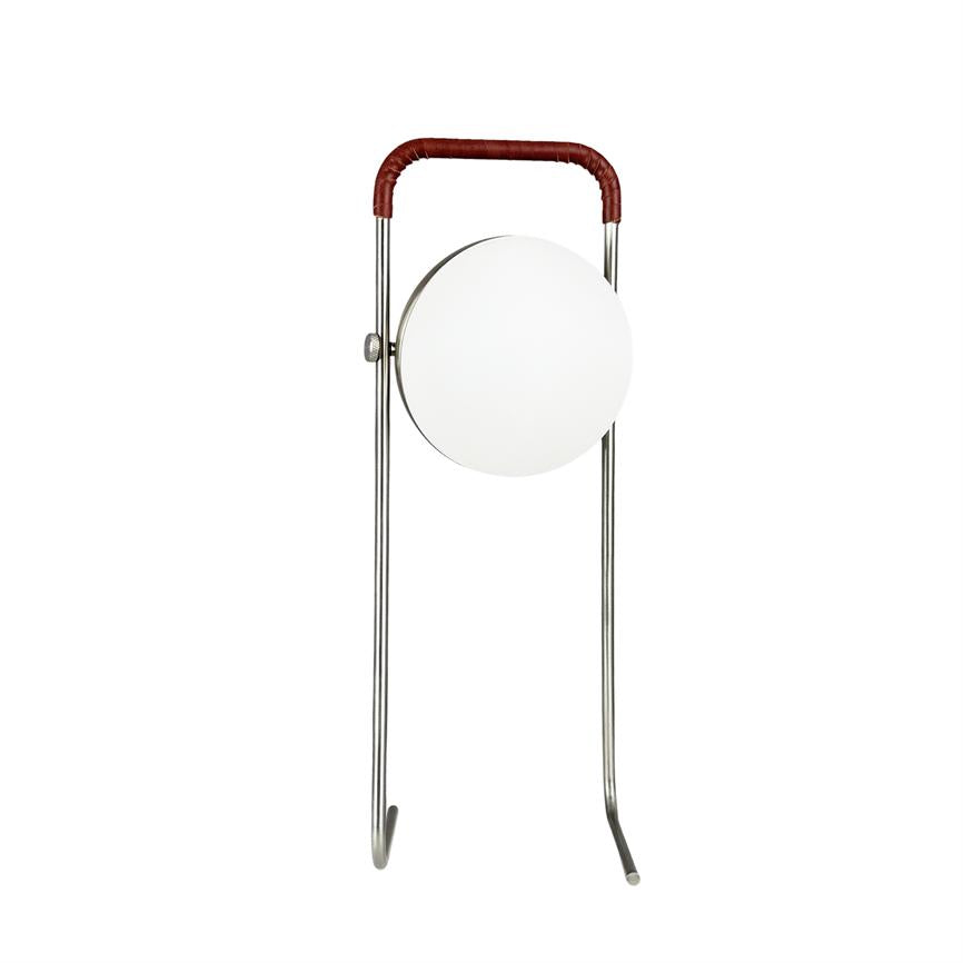 Standing lamp with two thin, chrome-plated legs and a brown handle, which holds a round, white opal shade hanging in the middle between the legs on a white background.