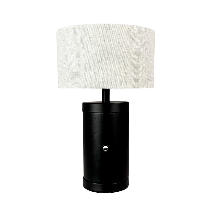 Black, cylindrical table lamp stands centered, with a white fabric shade on top, against a uniform white background.
