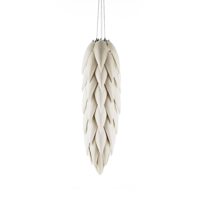 Long cone-shaped pendant made of overlapping white, leaf-like lamellae; hangs from three thin wires and floats isolated against a neutral white background.