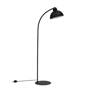 Black metal floor lamp with round base; a curved bar leads to a hemispherical screen that points downwards against a white, uniform background.
